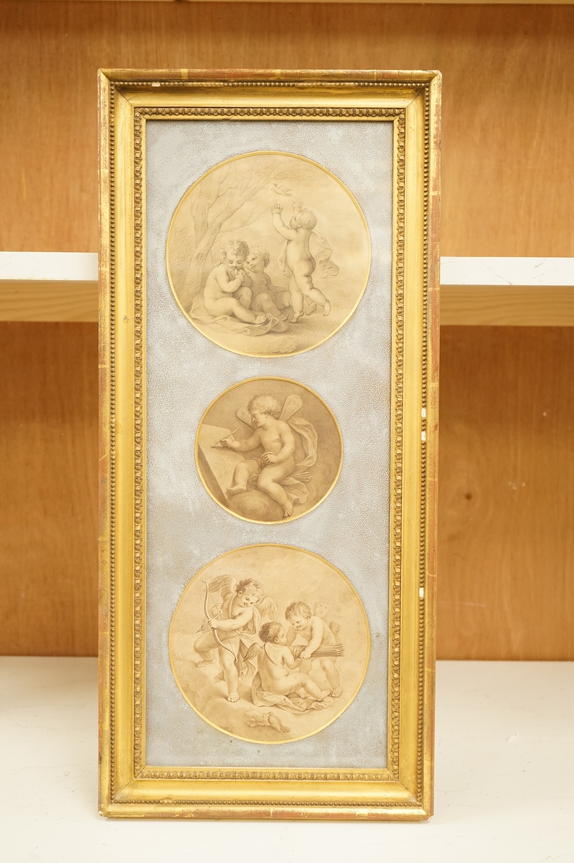 After Francesco Bartolozzi RA (Italian, 1727-1815), Children and doves, set of three tondo stipple engravings, mounted and framed as one, largest 17cm diameter